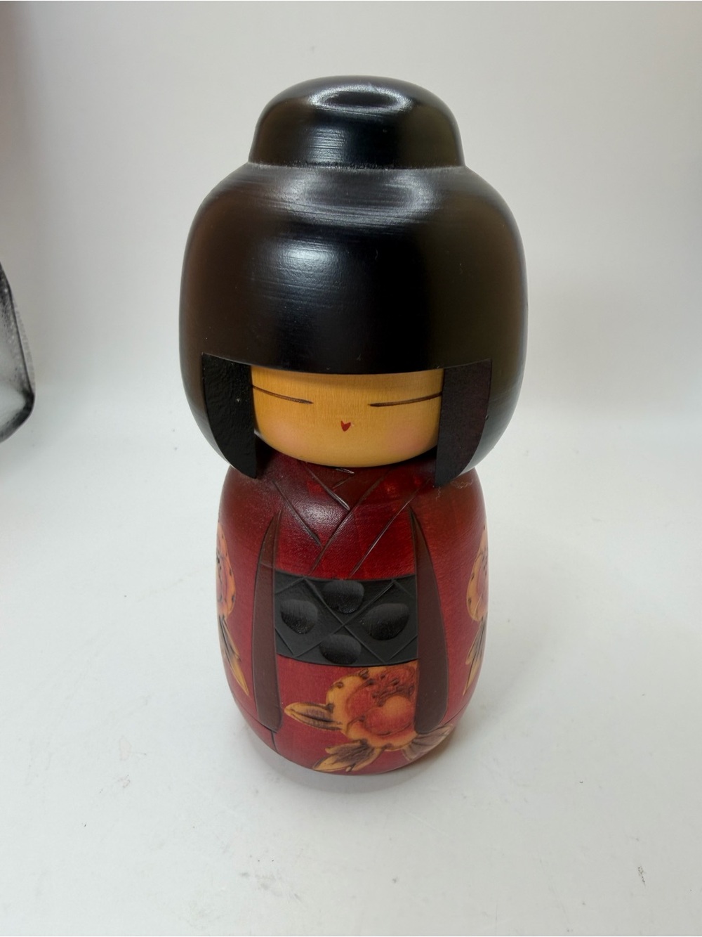 Signed Wooden Kokeshi Doll in Red and Black